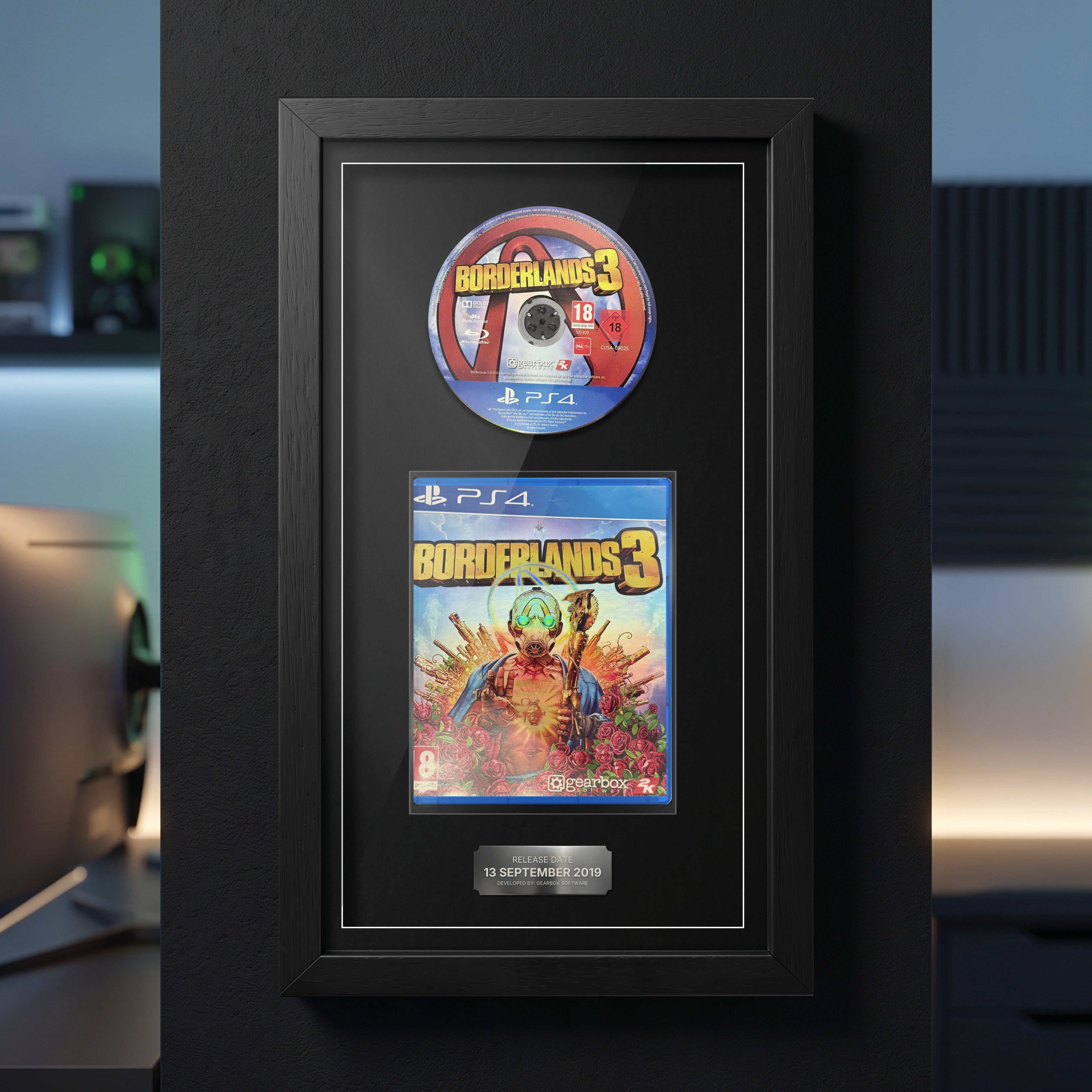 Borderlands 3 PS4 Exhibition Range frame on a dark wall with the disc and case on display
