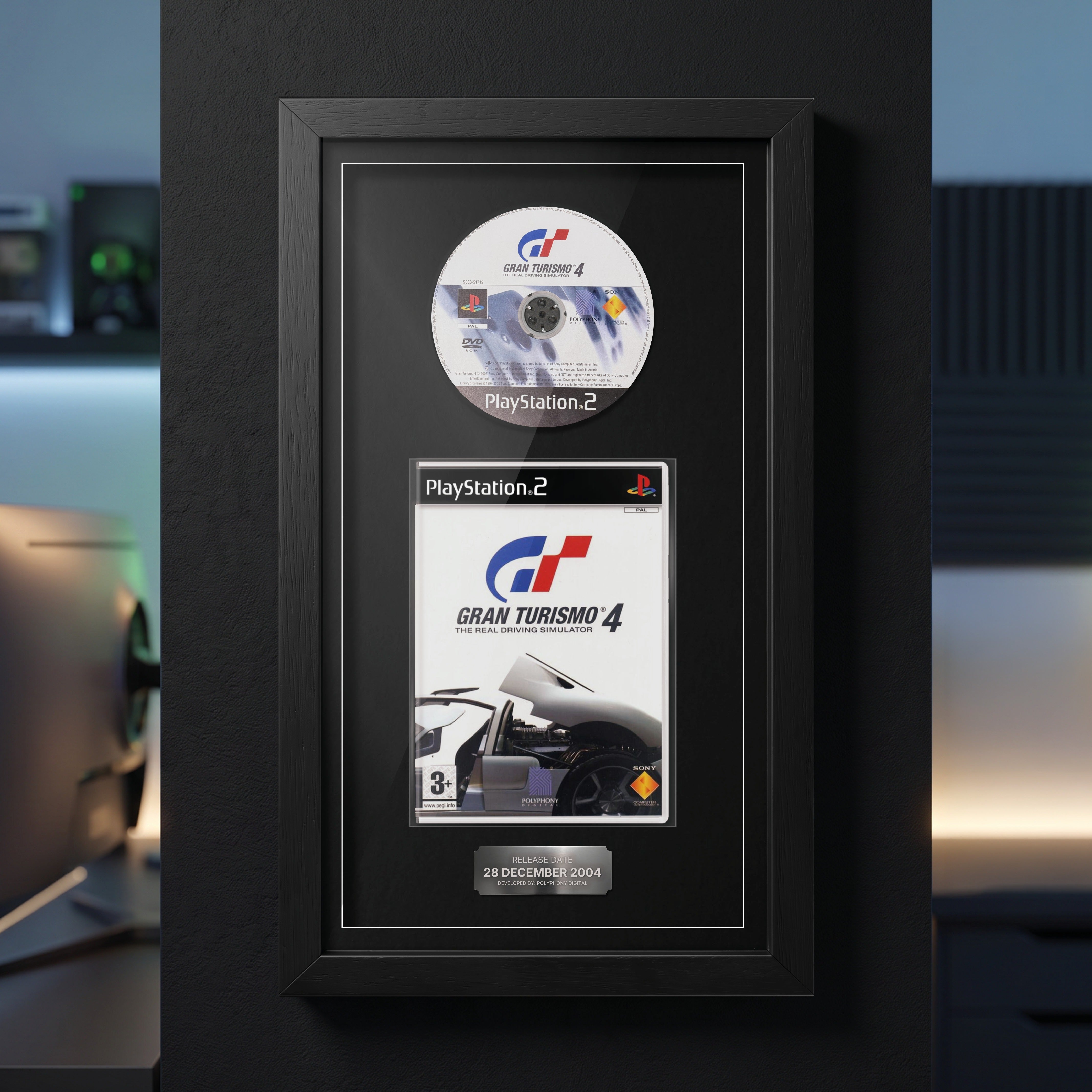 Gran Turismo 4 PS2 Exhibition Range frame on a dark wall with the disc and case on display