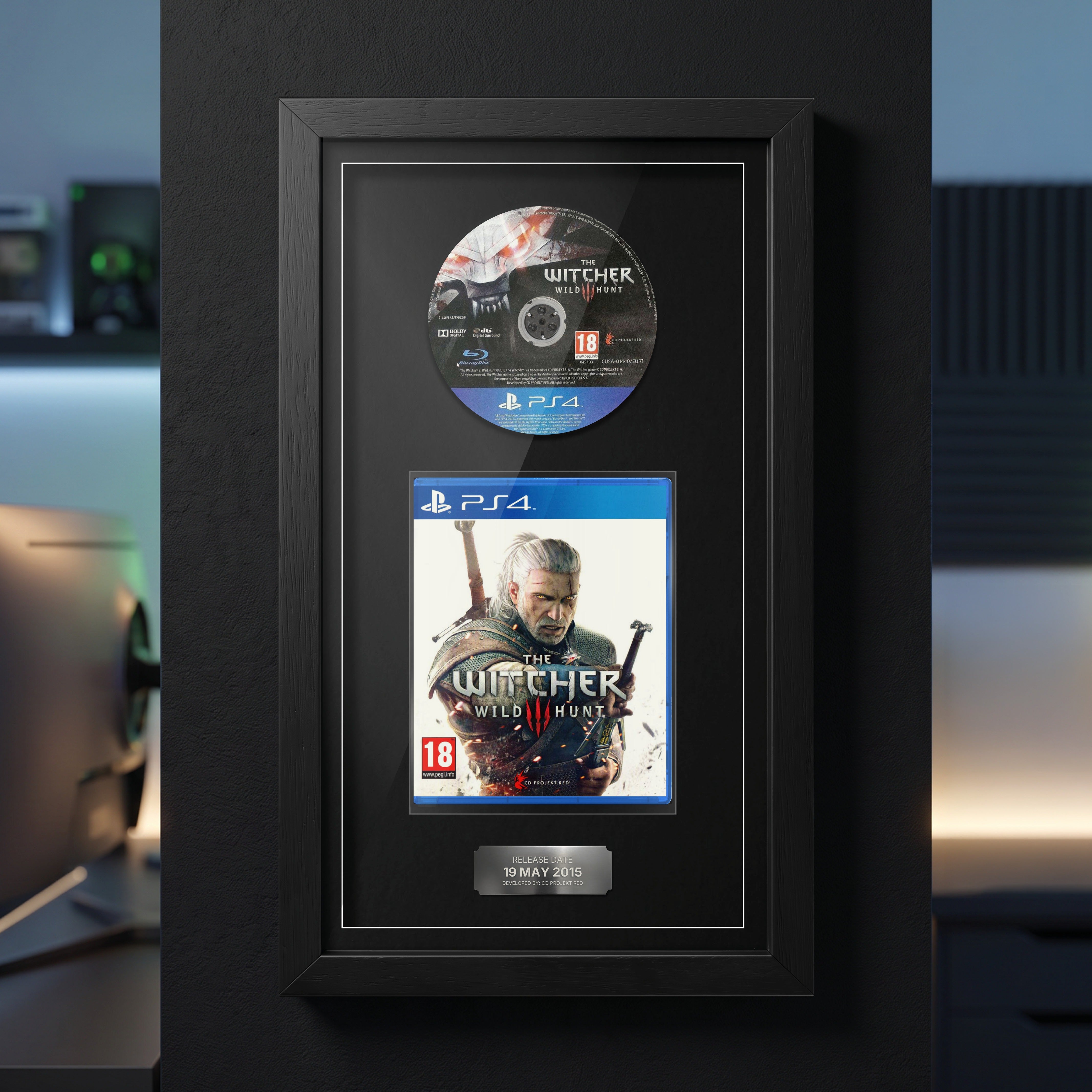 The Witcher 3: Wild Hunt PS4 Exhibition Range frame on a dark wall with the disc and case on display